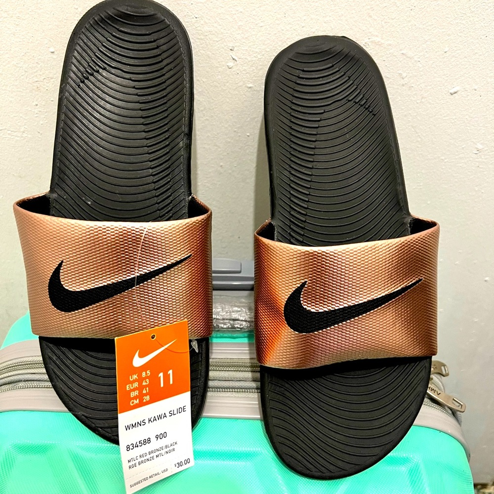 Brand new Nike gold slides. Original tags, never worn